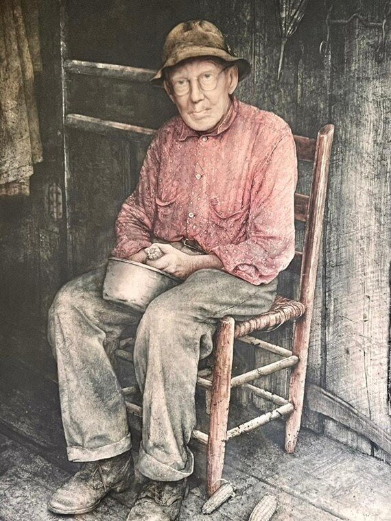 Elderly man seated in a ladder-back chair holding a pan, watercolor print by Hubert Shuptrine